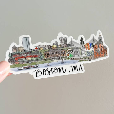 Sticker of Boston, MA skyline held by a hand on a gray background
