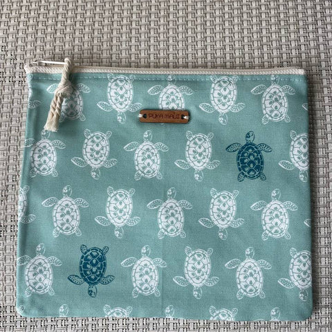 Fabric pouch with turtle pattern on a textured surface