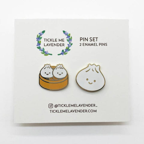 Pin set with two enamel pins on a branded card, featuring the brand 'Tickle Me Lavender'.