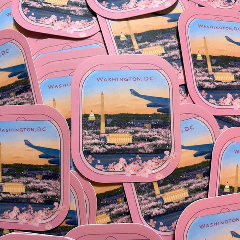 Stickers with Washington, DC skyline and cherry blossoms in pink frames.