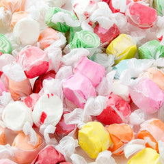 Assorted colorful hard candies on a white background