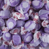 Close-up of purple candy with white accents and pink centers.