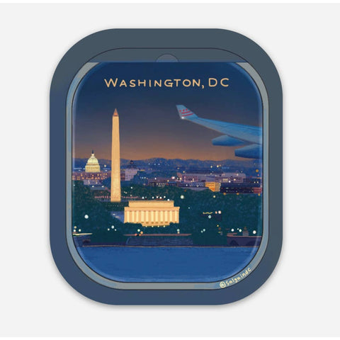 Window view of Washington, DC with the Washington Monument and Lincoln Memorial at night.