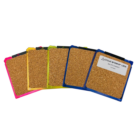 Set of cork coasters with colorful edges on a white background