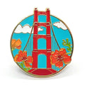 Pin with a design of the Golden Gate Bridge and flowers on a blue background