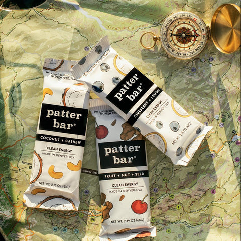 Patter Bar energy bars on a map with sunglasses and compass