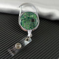 Retractable badge holder with green circuit board design on a textured surface