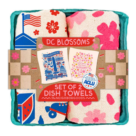 Set of 2 dish towels with various designs in a decorative box labeled 'DC Blossoms'.