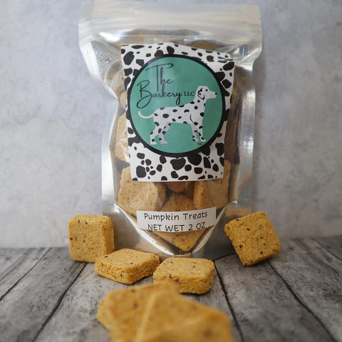 Packaged pumpkin treats with a visible brand label on a wooden surface.