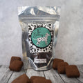 Bag of brownie treats with 'The Barkery' label on a wooden surface