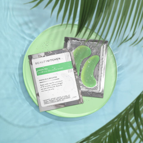 Green tea eye patches on a green plate with palm leaves in the background