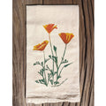 Floral design on a towel against a wooden background