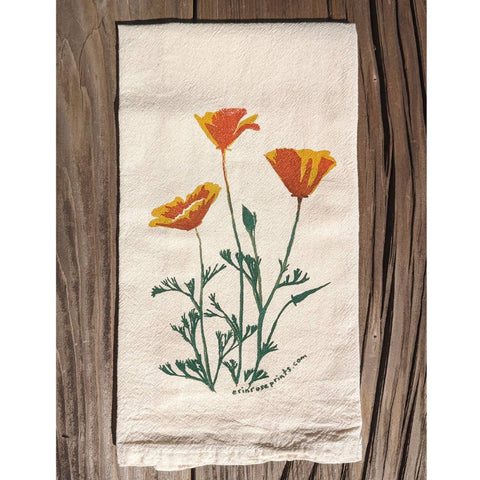 Floral design on a towel against a wooden background