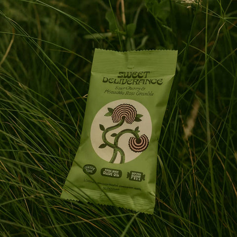 Green package labeled 'Sweet Deliverance' on grass