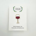 Wine glass enamel pin on a white card with 'Tickle Me Lavender' branding.