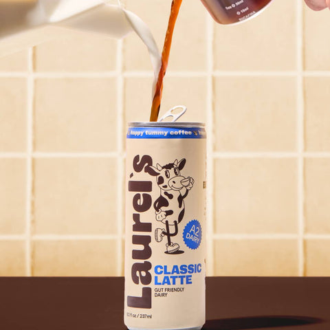 Laurels Classic Latte can being poured with a tiled background