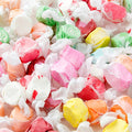 Assorted colorful hard candies on a white background