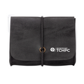A black textured pouch or organizer with a front flap, a vertical braided strap closure, and a white TCHPC logo printed on the lower right of the flap, shown against a plain white background.