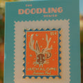 Enamel pin packaging with a jackalope design on a teal card