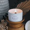 Candle in a decorative holder with a dark background