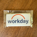 Workday logo on a wrapped product on a wooden surface