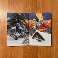 Two winter-themed greeting cards on a wooden surface