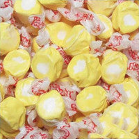 Assorted hard candies with yellow, red, and white colors.