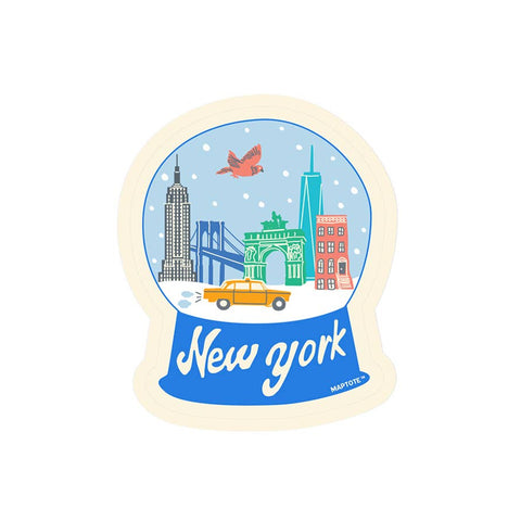 Sticker of a New York-themed snow globe with iconic buildings and a taxi.