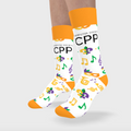 White socks with colorful patterns and 'CPP' text worn by a person on a light gray background