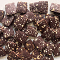 Chocolate bars with nuts on a white background