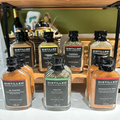 Collection of 'Distilled' spice bottles on a shelf with a blurred background