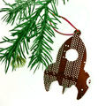 Decorative reindeer ornament with polka dot pattern hanging on a green branch.