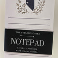 Notepad with 'Battle Born' branding and decorative elements on a white background