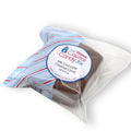 Packaged milk chocolate caramel cloud with 'The Capital Candy Jar' label on a white background