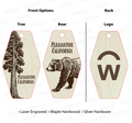 Wooden tags with tree, bear, and logo designs on a white background.