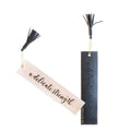 Two bookmarks with tassels on a white background