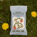 Sweet Deliverance granola packet on grass with dandelions