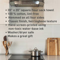 Kitchen scene with a flour sack towel hanging on an oven door, featuring product details.