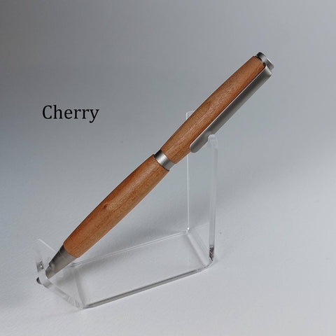 A cherry wood pen with silver metal accents displayed on a clear acrylic stand against a light gray background, with the word 'Cherry' printed on the left.