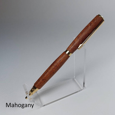 A mahogany wood pen with gold-tone metal accents, displayed diagonally on a clear acrylic stand against a neutral gray background.