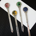 Set of four forks with electronic components on a white napkin against a black textured background