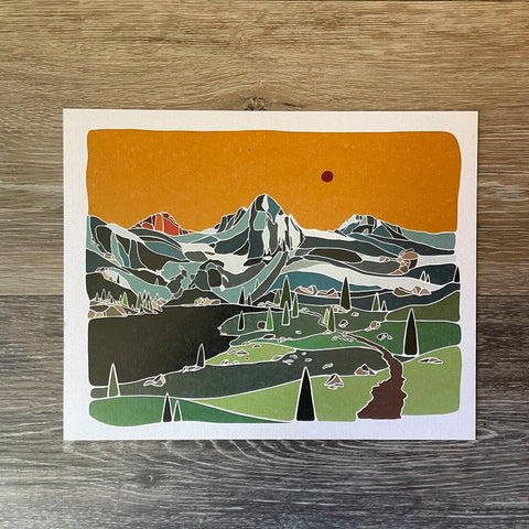 Illustration of a mountain landscape on a wooden surface