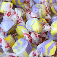 Assorted colorful candies with visible brand logo