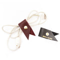 Leather lanyard with a small flag attachment on a white background