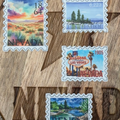 Stylized postage stamps of Nevada on a wooden surface