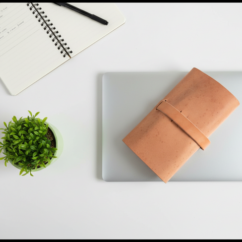 Tan leather wallet on a white background