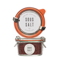 Jar of sous salt with orange lid on a white background