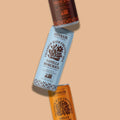 Two Sonreir coffee sticks with different flavors on a beige background