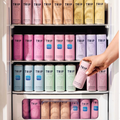 Vending machine filled with 'TRIP' branded cans in various colors, with a hand reaching out to grab one.