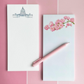 Two stationery items with designs on a pink tiled background
